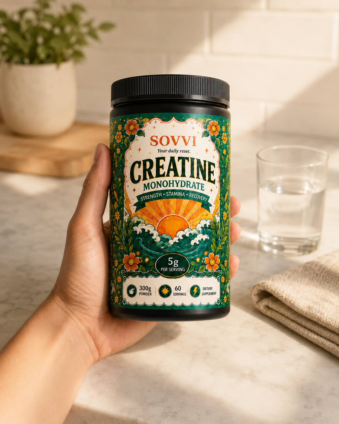 Hand holding a bottle of Sovvi Creatine Monohydrate